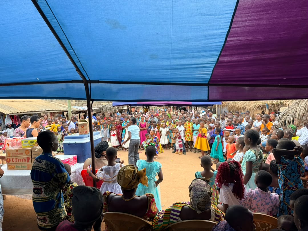 Children and families gathered for a community programme